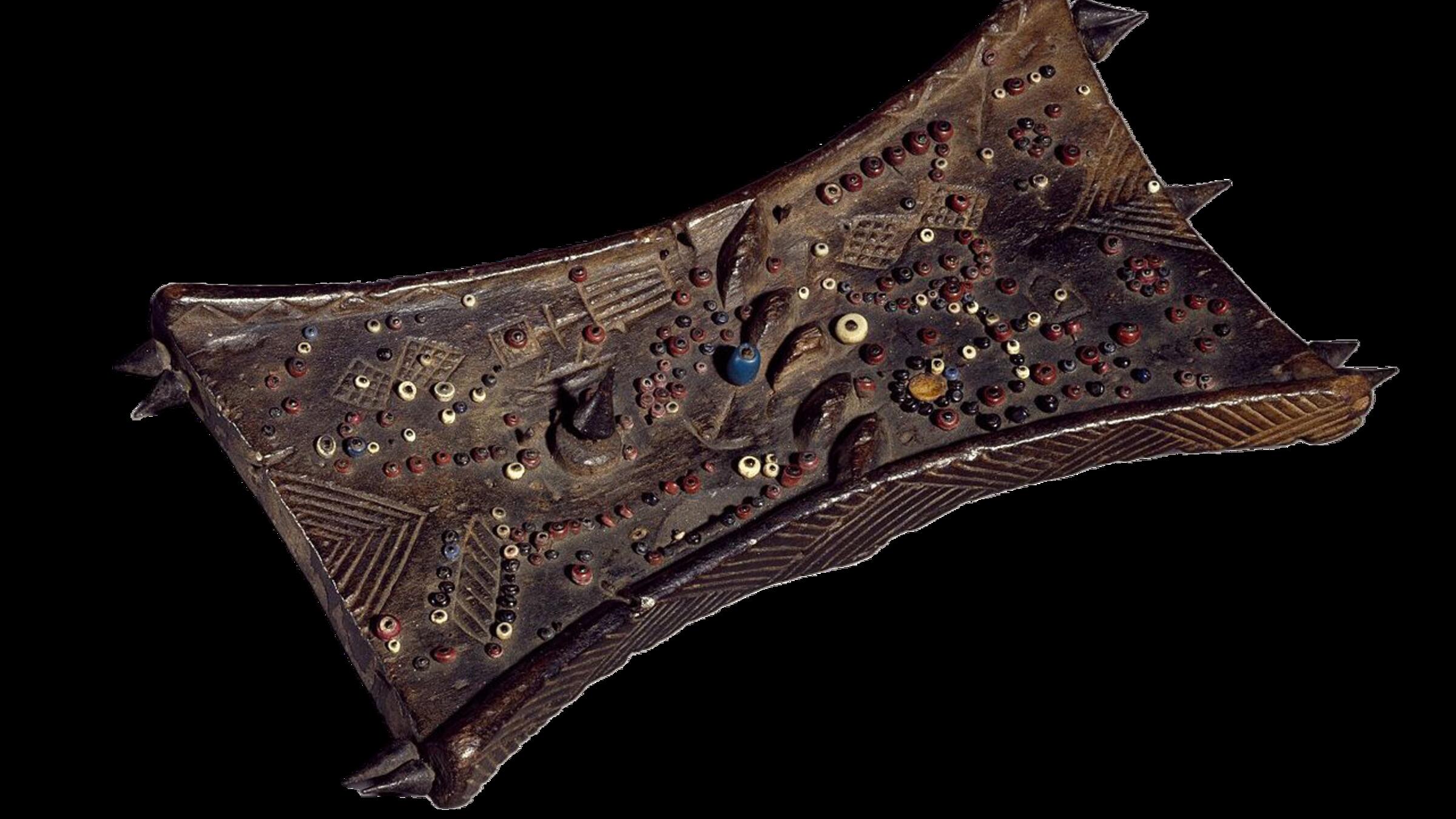 Lukasa memory board, hourglass-shaped wooden tablet covered with multicolored beads and carved symbols