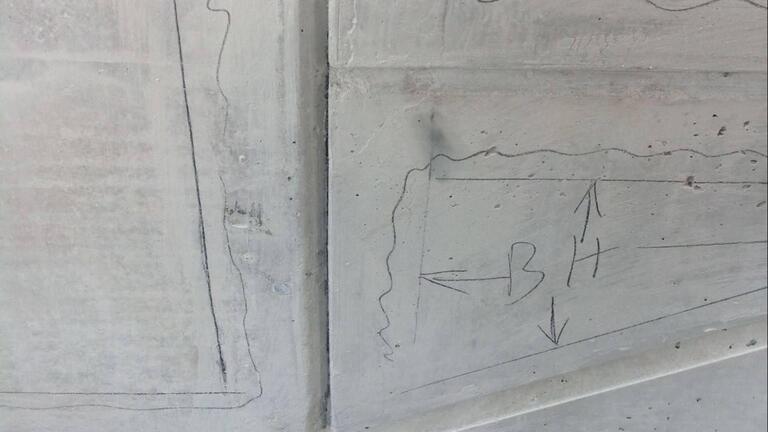 Cement marked with pencil.