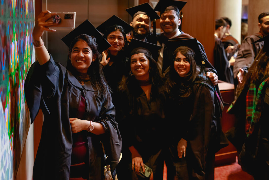 Carnegie Mellon Architecture graduates pose for a selfie before the diploma ceremony
