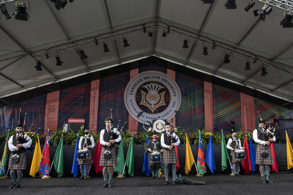 Bagpipers perform onstage during CMU’s Main Commencement Ceremony